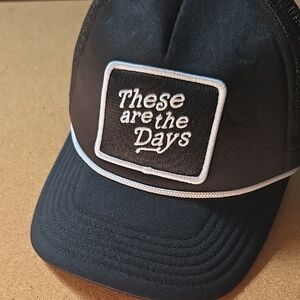 Black Trucker Hat with Embroidered Patch